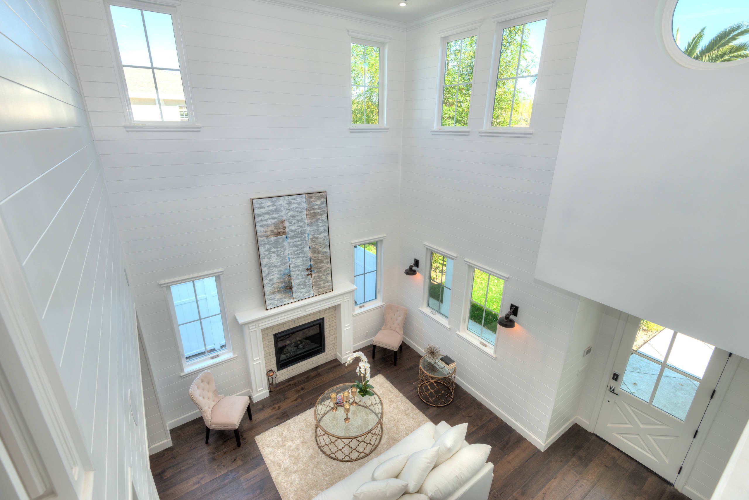 The double-height living room of the Sherman Oaks residence seen from the landing.