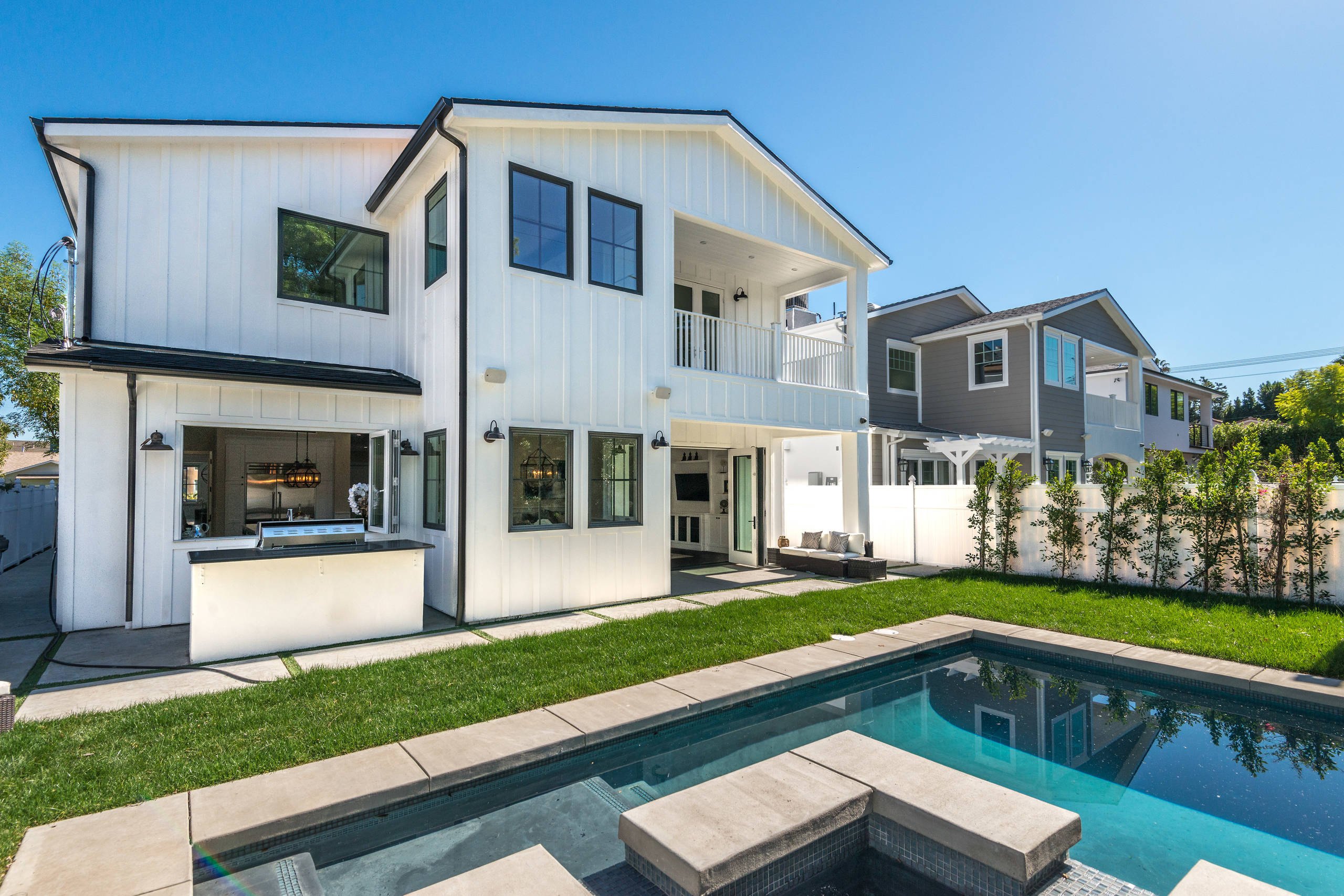The rear of the Sherman Oaks residence with its pool and spa.